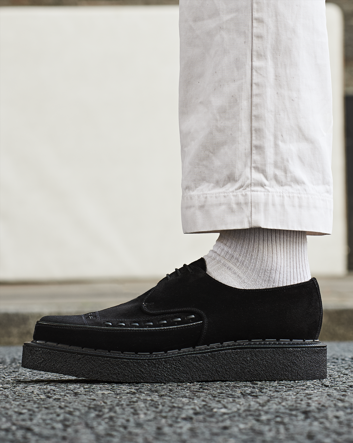 Black suede Diano Creeper on pavement