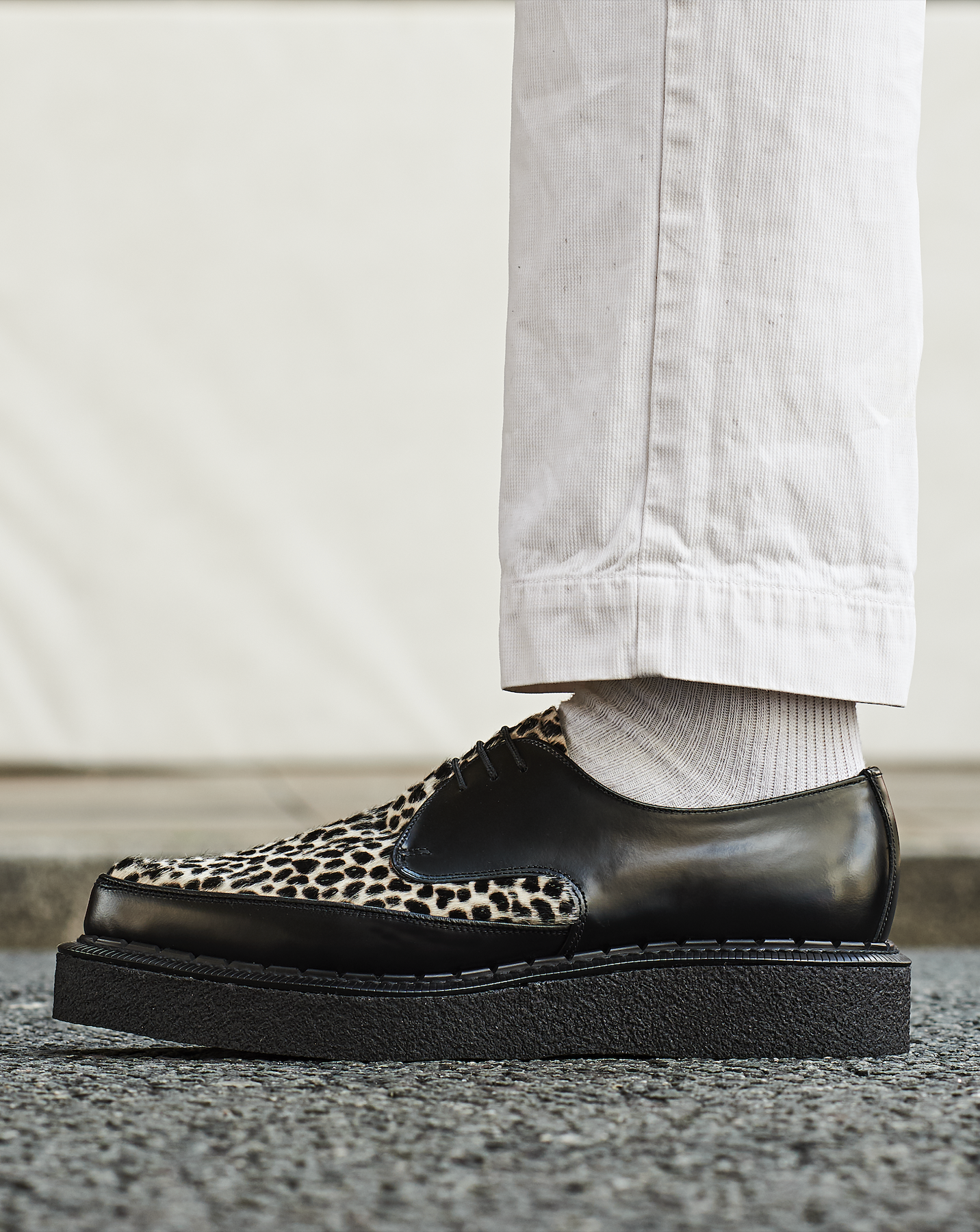 Black and leopard Diano Creeper on pavement