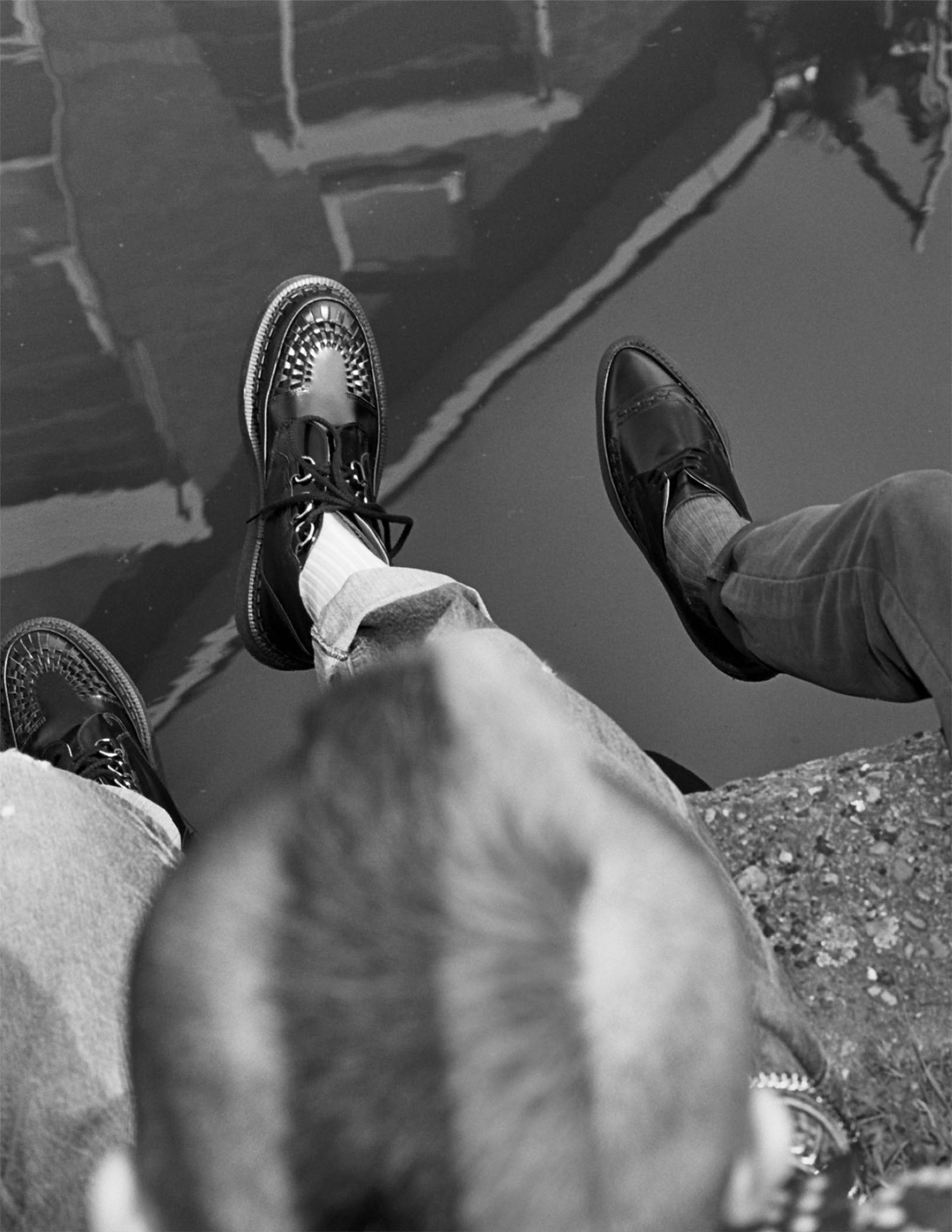 Punks sitting on the edge of a canal in George Cox Creepers